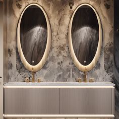 two round mirrors are on the wall above a double sink in a bathroom with marble walls