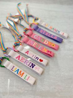 four lanyards with name tags attached to them