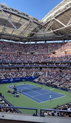 a tennis match is being played in an empty stadium