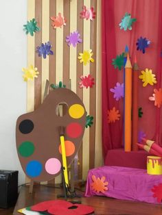 a child's room decorated with colorful paper flowers and crayons