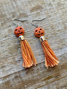 Handmade with howlite pumpkin beads and orange threaded tassels 🎃 Earrings measure 2 7/8 inches long. These can be made into infinity wires for people with tunnel gauges. Message me if this is what you need! Adjustable Dangle Tassel Earrings As Gift, Adjustable Orange Tassel Earrings, Orange Tassel Drop Earrings As Gift, Orange Tassel Drop Earrings For Gift, Orange Tassel Drop Earrings, Orange Beaded Tassel Earrings As Gift, Orange Tassel Dangle Earrings, Orange Tassel Earrings Gift, Orange Tassel Earrings