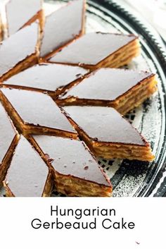 there are several pieces of cake on the plate and one has been cut into squares