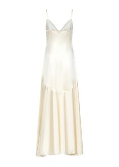 a white dress with spaghetti straps on the neck and bottom, in satin material that looks like silk