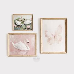 three paintings on the wall, one with a white swan and one with a pink butterfly