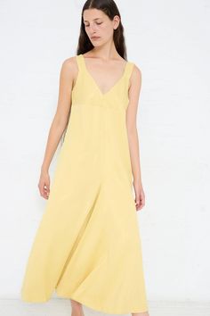 Slip dress made from a fluid viscose crepe. Features thick straps, a deep v-neckline and an asymmetric pleat at front. Color: Butter (Yellow) Material: 83% Viscose, 17% Virgin Wool Regular fit Natalie is 5'10" and wears a UK10. Sleeveless Silk V-neck Dress For Summer, Silk V-neck Summer Dress, Elegant Yellow V-neck Dress For Spring, Yellow Asymmetrical Hem Dress For Spring, Spring Yellow Dress With Asymmetrical Hem, Yellow Bias Cut Dress For Summer, Yellow Bias Cut Summer Dress, Sleeveless Silk V-neck Dress For Spring, Silk V-neck Slip Dress For Summer