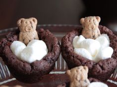 chocolate cookies with marshmallows and teddy bears in the middle