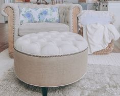 a living room filled with furniture and pillows