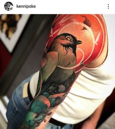 a man's arm with a bird and flowers tattoo on the left arm, which has an orange circle in the background