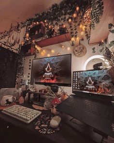 two computer monitors sitting on top of a desk