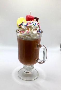 a hot chocolate drink with whipped cream and sprinkles