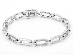 0.90ctw round white diamond, rhodium over sterling silver tennis bracelet. Measures approximately 3/16"W and has a hidden box clasp closure. Modern Silver Diamond Bracelet With Prong Setting, Silver Diamond Bracelet With Oval Link And Diamond Accents, Silver Diamond Bracelet With Diamond Accents, Silver Oval Link Diamond Bracelet For Anniversary, Silver Diamond Bracelet For Anniversary, Modern Silver Tennis Bracelet With Diamond Accents, Silver Diamond Bracelet With Oval Links, Modern Silver Diamond Bracelet With Pave Setting, Silver Diamond Oval Link Bracelet