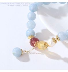 This elegant color stone bead bracelet features light blue aquamarine beads, 7 mm bead diameter, with a dangle drop bead, gold metal bead cap as an accent, on elastic band for easy fitness. Add this elegant bead bracelet to your everyday fashion jewelry collection or as gift for your love one. Jewelry Care: See more information about how to care for your jewelry here. Shipping Policy: Orders will be shipped within 1-3 business days. Economy shipping will take 7-14 days to arrive and standard shi Elegant Light Blue Jewelry With 8mm Beads, Elegant Aquamarine Beaded Bracelets, Diy Bead Bracelets, Easy Fitness, Jewerly Making, Metal Bead, Aquamarine Beads, Elegant Color, Drop Beads