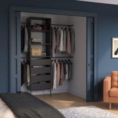 a bedroom with blue walls and an open closet in the corner, next to a couch