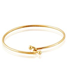 Our delicate handmade bracelet with the double ball closure is a favorite worn alone or with our Skinny Galaxy, Cabochon Spring Gold or Monogram Bangle. Standard size is 6.5. Please inquire if you need a custom size. Excellent gift for MEN too! Dimensions: 3.5MM Gold Wire 14kt Gold Handmade in Beverly Hills Classic Adjustable Hoop Bracelets, Adjustable Yellow Gold Round Cuff Bracelet, Hoop Bracelet With Polished Finish As A Gift, Classic Bangle Bracelet With Spring Ring Clasp, Classic Hoop Jubilee Bracelet, Classic Jubilee Hoop Bracelets, Adjustable Yellow Gold Hoop Bracelets, Classic Adjustable Gold Bracelet, Adjustable Round Flexible Cuff Bracelet