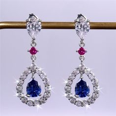 Romantic Royal Blue Water Drop Hollow Dangle Earrings For Women, Unvn12433 Metal: 925 Sterling Silver Plated Stone: Cubic Zirconia High Quality Metal Hand Crafted With Love And Care Perfect For Gift, Holiday, Christmas, Birthday, Vacation, Mother's Day, Valentine's Day, Wedding, Engagement , Bridal, Promise, Anniversary, Party Please Feel Free To Message Me If You Have Any Questions. Thank You For Shopping With Us! Blue Sterling Silver Earrings For Evening, Silver Sapphire Earrings For Party, Blue Sterling Silver Earrings For Party, Silver Sapphire Drop Earrings, Blue Dangle Teardrop Earrings For Anniversary, Blue Teardrop Earrings For Anniversary, Elegant Blue Sterling Silver Teardrop Earrings, Elegant Blue Teardrop Earrings For Anniversary, Elegant Blue Teardrop Earrings For Party