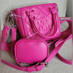 Destashing My Steve Madden Collection. I Am Obsessed With Steve Madden And I Thank Tik Tok For Addiction But I Need To Make Room For New Collection Pieces! Please See My Closet For More Listings. Last 2 Photos Show A Marking That Has Been Embedded Due To Storing And Another Rbag Fell Ontop I Have Discounted For This Reason! Steve Madden Bbabi Fushia Satchel Crossbody Bag. 2 Side Handle Bag With Removable Crossbody Straps. 2 Crossbody Straps, Faux Leather And A Material Strap. Silver Hardware Rem Trendy Small Bag With Removable Pouch, Trendy Small Bags With Removable Pouch, Air Pod, Earbuds Case, Crossbody Satchel, Steve Madden Bags, Air Pods, 2 Photos, Satchel Bag