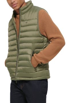 A quilted stand collar and lightweight fill insulate this heat-keeping puffer vest. 26 1/2" length (size Medium) Stand collar Front zip closure Front zip pockets Water resistant 100% nylon Machine wash, tumble dry Imported Spring Quilted Puffer Jacket For Outdoor Activities, Casual Nylon Puffer Jacket With Zipper, Casual Nylon Puffer Jacket With Zipper Closure, Solid Color Quilted Puffer Jacket, Winter Nylon Vest With Zipper Closure, Nylon Vest With Zipper Closure For Winter, Spring Outdoor Puffer Vest, Nylon Vest With Zipper Closure For Fall, Casual Nylon Vest With Zipper Closure