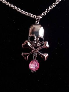 "Gunmetal black skull head with cross  bones pendant with a pink shimmer crystal bead necklace. The chain is matte finish antique silver metal chain. Gothic style great for halloween, birthdays, gifts for her, gifts for him or just to show off your love for skulls.  Measurements: chain 16\" pendant 1 1/2\" bead 8mm" Era Outfits, Halloween Birthdays, Crystal Beads Necklace, Grunge Necklace, Grunge Jewelry, Halloween Gothic, Cross Bones, Gold Skull, Bone Pendant