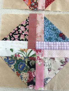 a patchwork quilt with several different patterns on it