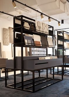 a room filled with lots of books and furniture