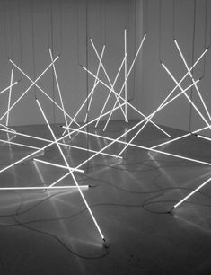 an array of sticks and wires in black and white