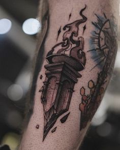 a man with a tattoo on his arm