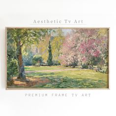 a painting hanging on the side of a white wall next to a tree and grass field