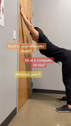 a woman standing on one leg in front of a door with the caption, not in your shoulder blade? sit at a computer all day?