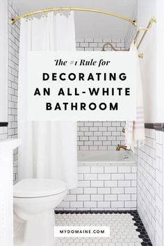 a white bathroom with black and white tile flooring, shower curtain, and bathtub