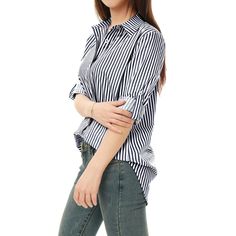 Clean stripes lend a graphic touch to this button-down shirt. A trendy high-low hem and roll-up sleeves for added laid-back appeal. Wear this on the weekend running errands or Sunday brunch. Pair it perfectly with your favorite trousers and heels for an instant charming outfit. Amp up your ensemble with this striped shirt. Trendy Button-up Shirt With Rolled Sleeves, Casual Striped Tops With Roll-up Sleeves, Trendy Shirt With Roll-up Sleeves And Shirttail Hem, Trendy Striped Button-up Shirt, Trendy Long Sleeve Shirt With Roll-up Sleeves, Trendy Long Sleeve Tops With Roll-up Sleeves, Trendy Relaxed Fit Shirt For Office, Trendy Relaxed Fit Office Shirt, Striped Button-up Tops With Button Closure