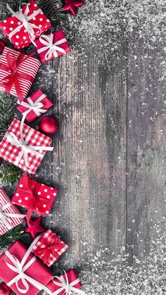 red and white christmas presents on wooden background