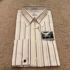 Vintage Burberry Dress Shirt. New With Tags. Size Is 15.5 (32-33). 100% Cotton. Shirt Is Pinned In Original Packaging, So I’ve Opted Not To Take It Off To Photograph. However, Let Me Know If You Need Additional Information And I’d Be Happy To Help. White Short Sleeve Dress Shirt For Formal Occasions, Elegant Dress Shirt For Daywear In Spring, Elegant Spring Dress Shirt For Daywear, Elegant White Dress Shirt For Daywear, Classic Spring Dress Shirt For Daywear, White Formal Dress Shirt For Spring, Elegant White Dress Shirt For Spring, Classic White Shirt For Spring, White Formal Shirt For Spring