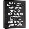 a black book with white writing on the front and back cover that says, may you be proud of the work you do