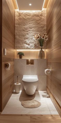 a modern bathroom with wood paneling and stone walls, along with a round rug on the floor