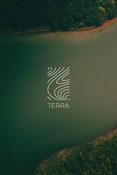 the logo for terra is shown on an aerial view of water and trees in the background