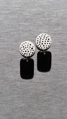 These dangle earrings were constructed from white earthenware clay and painted a solid black rectangle dangle with a round black polka dot top. The measurements of these ceramic earrings are 7/8" width by 2 1/8" length. The earring posts, attached securely to the back, are surgical steel (hypoallergenic base). These artsy earrings will make a fun accessory as well as a great gift that will arrive in a gift box. Please check out our shop for more wearable art. www.etsy.com/shop/pickneycreations Thanks for looking! Black Hand Painted Drop Earrings, Artistic Black Dangle Earrings, Hand Painted Black Polymer Clay Earrings, Black Polymer Clay Earrings For Everyday, Everyday Black Polymer Clay Earrings, Black Polymer Clay Earrings With Ear Wire, Artsy Earrings, Black Polka Dot Top, Earrings Ceramic