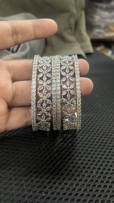 Ashura jewels beautiful wedding wear diamond bangle set this is a 6 pcs Kada bracelet silver polished bangle set this set is very easy to wear. we ship our items everywhere. Colour white design bangle stone Pearl beads  2.4,2.6,2.10,2.12 Size available These openable bangles can be wear by 2.8 size person.   material gold plated Standard shipping takes 3 to 4 weeks to deliver the parcel if a customer needs an item urgently then we can ship the item through Express shipping it takes 3 to 6 days t White Stone Bangles, Diamond Kada, Wedding Women, Bracelets Design, Indian Bollywood, Diamond Bangle, Pakistani Wedding, Bangle Set, Bead Jewellery