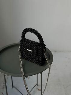 Luxury Black Beaded Evening Bag, Black Handheld Box Bag, Black Clutch Box Bag As Fashion Accessory, Elegant Black Beaded Bags, Black Beaded Pouch Clutch, Black Top Handle Bag With Pearl Handle, Black Top Handle Box Bag For Gift, Black Square Box Bag For Gifts, Black Beaded Bags As Fashion Accessory