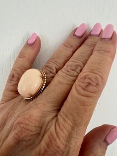 Vintage Angel Skin Coral Cabochon Ring set in 14K Yellow Gold  Circa 1970 Size 6 1/2 US Estate piece Comes in a gift box Eye Candy!! Victorian Cabochon Rings As Gifts, Victorian Cabochon Rings For Gift, Victorian Cabochon Rings As A Gift, Vintage Cabochon Rings For Gifts, Vintage Cabochon Rings As Gift, Victorian Oval Cabochon Rings For Gift, Vintage Oval Cabochon Ring For Gift, Vintage Oval Cabochon Ring As Gift, Vintage Oval Cabochon Ring As A Gift