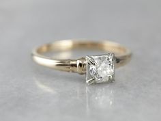 This vintage engagement ring is sweet and feminine, while still being easy to wear every day. The stone is encased in the square, white gold head. This protects the lovely European cut diamond, and also allows some light into the bottom to shine up through the stone. The shoulders have a simple motif, giving them a little texture and depth. All in all, this is a lovely piece! Metal: 14K Yellow and White Gold Gem: European Cut Diamond .50 Carats, I2 in Clarity, I in Color Gem Measurements: 4.9 mm Simple Motif, European Cut Diamond Engagement Ring, European Cut Diamond Ring, Retro Era, Vintage Engagement Ring, Engagement Ring Vintage, European Cut Diamonds, Vintage Engagement, Ring Vintage