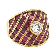 This stunning tapered statement ring is composed of baguette and calibre cut rubies surrounding a single G color round brilliant bezel set diamond, expertly set in 18 karat yellow gold. Ruby total carat weight - 6.27cts Diamond 0.25 carat round brilliant diamond, G color VS2 clarity Ring size is a 7. Contact us for ring sizing ability Dome Rings, Ring Bezel, Bezel Set Diamond, Domed Ring, Ruby Ring, Brilliant Diamond, Bezel Setting, Statement Ring, Round Brilliant