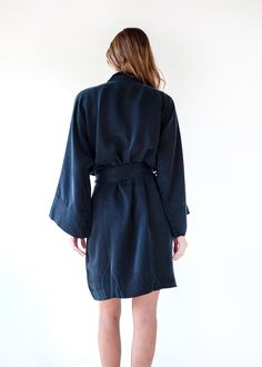 The vegan silk kimono that we already know and love, now with an exciting twist. It's time to show a little leg in our new Mini. Sustainably made using our washable vegan silk, this classic fit features a wrap front silhouette with a matching detachable sash, and voluminous wide sleeves - designed and cut to beautifully fit all sizes. This is the closet-staple mini dress that every wardrobe needs. Enjoy it in the comfort of your home, by the pool over your favorite bikini, or dressed up for any Silk Wrap Kimono For Daywear, Silk Wrap Kimono For Loungewear, Silk Fitted Robe For Loungewear, Fitted Silk Robe For Loungewear, Fitted Wrap Robe, Silk Wrap Robe With Tie Waist, Chic Silk Wrap Robe, Silk Fitted Robe For Spring, Fitted Silk Robe For Daywear