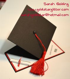 a graduation cap and diploma laying on top of each other