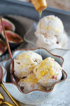 a bowl filled with ice cream sitting on top of a table