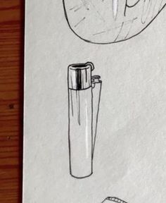 a drawing of a lighter and an object on a piece of paper that is sitting on a table