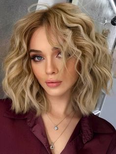 Blonde thick wavy curly hair with layered waves