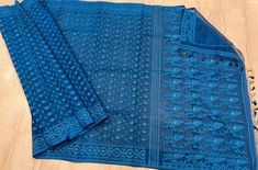 Bengal Traditional Soft Reshom Dhakai Jamdani in beautiful blue coliur . This gorgeous  saree depict the craftsmanship of Bengal weavers .  Saree is 5.5 Mt. Without blouse piece but can customise your choice of blouse material .  Fall and picot complimentary .    Please leave your phone no and email id while booking for shipping purpose. Feel free to contact me on my Whatsapp number ( to get just leave a message ) . Traditional Blue Pre-draped Saree With Self Design, Traditional Blue Pre-draped Saree With Dupatta, Blue Saree With Self Design, Blue Saree With Traditional Patterns, Traditional Blue Dupatta With Patterns, Blue Saree With Traditional Patterns For Puja, Blue Saree With Traditional Patterns For Festivals, Blue Self Design Traditional Saree, Blue Self Design Saree For Diwali