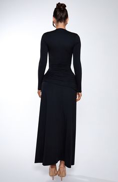 Make a statement in our Ysabella maxi dress. It stands out for it's sleek, sexy details including a deep, plunge neckline, thigh high split and ruched knot detailing. Finish the look with a pair of statement earrings and a glossy lip, and you'll be turning heads the whole night. 



Colour: Black.

Fully lined.

Long, slim fitting sleeves.

Ruched, knot detail on hip.

Thigh high split.

Deep plunge neckline.

Maxi length.

Model is an XS and is wearing an XS.

 Size: XS, S, M, L, XL, XXL Luxury Black Ruched Maxi Dress, Sleek Black Long Sleeve Maxi Dress, Sleek Black V-neck Maxi Dress, Black V-neck Maxi Dress With Cutout, Black Cutout Floor-length Maxi Dress, Black Thigh High, Split Long Dress, Bandeau Tops, Loungewear Dresses