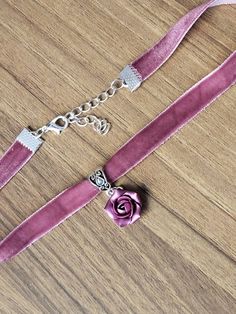 "Pink-purple velvet ribbon choker with sculpted handmade rose. Material of flower is polymer clay with special pearl cover. Each petal of flower made by hand Dia flower about 15 mm/ 0.55 \" Length of necklace is adjustable: 10-12 inches/ 25,4 - 30,5 cm 11-13 inches/ 28-33 cm 12-14 inches/ 30.5- 35.5 cm 13-15 inches/ 33-38 cm 14-16 inches/ 35.5 cm-40.5 cm 15-17 inches/ 38,1 cm- 43,2 cm 16-18 inches/ 40.6 cm- 45.7 cm 17-19 inches/ 43 cm - 48 cm 18-20 inches/ 45,5- 50.8 cm Width of ribbon 10 mm / 0 Floral Choker With Flower Charm As A Gift, Flower Charm Choker As A Gift, Flower Shaped Choker With Flower Charm As Gift, Adjustable Flower Pendant Choker For Gift, Adjustable Flower Pendant Choker Gift, Gift Flower Pendant Adjustable Choker, Rose Design Choker Necklace, Purple Choker Necklace For Gift, Adjustable Rose Choker Necklace