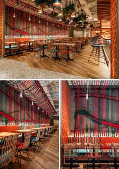 the inside of a restaurant with tables and chairs covered in red, blue, green and orange fabric